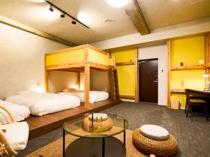 Una cama o camas en una habitación de Mange Tak Resort Onomichi