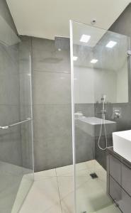 a bathroom with a shower and a sink at Ziv Apartments - Nordau 27 in Tel Aviv