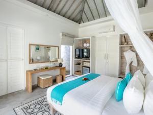 Kardia Resort Gili Trawangan A Pramana Experience客房内的一张或多张床位