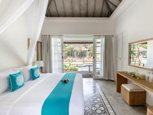 Kardia Resort Gili Trawangan A Pramana Experience客房内的一张或多张床位