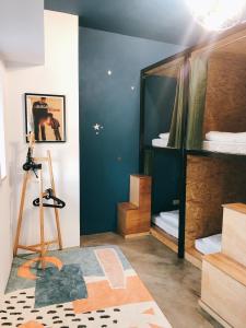 a room with two bunk beds and a mirror at South Talk B&B in Hengchun