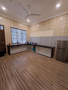 a large room with a dance floor with a fan at ZN Homestay Gong Badak in Kampong Pengkalan Maras