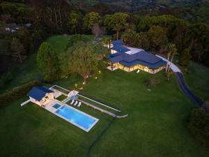 an aerial view of a estate with a swimming pool at Fairway in Goonengerry