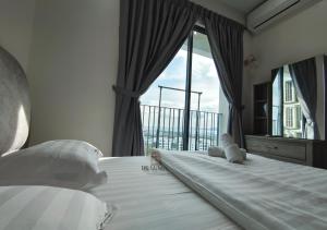 a bedroom with a bed with a large window at De Luma - Meritus in Perai +193 photos
