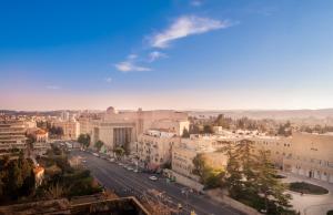 a view of a city with a street and buildings at Apartment Magical View in Jerusalem