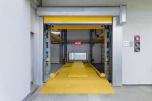 a hallway with a yellow floor in a building at Lemon Tree Hotel, Kalina, Mumbai in Mumbai