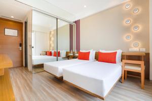 Postel nebo postele na pokoji v ubytování Lemon Tree Hotel, Kalina BKC, Mumbai