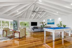 a living room with a ping pong table at The Estate Main House Byron Bay in Bangalow