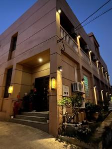 a building with lights on the side of it at Kinmen Old Town Homestay in Jincheng