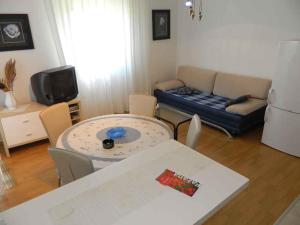 a living room with a couch and a table at Apartment in Valbandon - Istrien 27864 in Valbandon