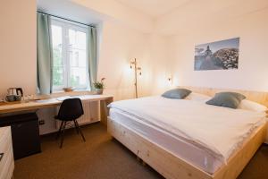 Ένα ή περισσότερα κρεβάτια σε δωμάτιο στο Hotel Rehavital