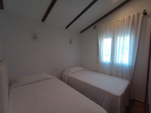 Postel nebo postele na pokoji v ubytování Casa de Campo Los Manueles Ideal Perros Pet Friendly