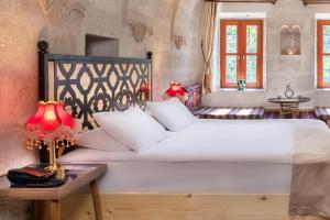 Postel nebo postele na pokoji v ubytování HacıAşık Konağı Butik Hotel