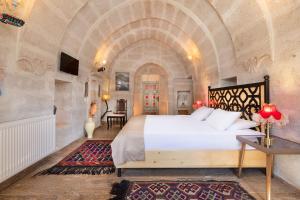 Postel nebo postele na pokoji v ubytování HacıAşık Konağı Butik Hotel