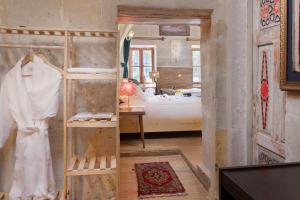 Postel nebo postele na pokoji v ubytování HacıAşık Konağı Butik Hotel