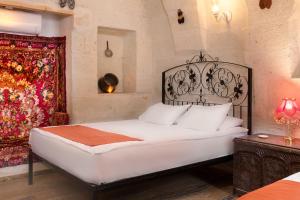 Postel nebo postele na pokoji v ubytování HacıAşık Konağı Butik Hotel