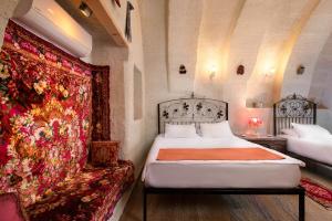 Postel nebo postele na pokoji v ubytování HacıAşık Konağı Butik Hotel