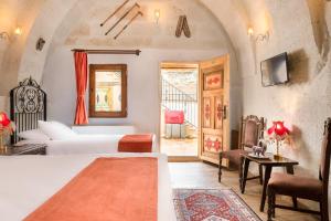 Postel nebo postele na pokoji v ubytování HacıAşık Konağı Butik Hotel