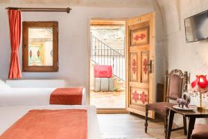 Postel nebo postele na pokoji v ubytování HacıAşık Konağı Butik Hotel