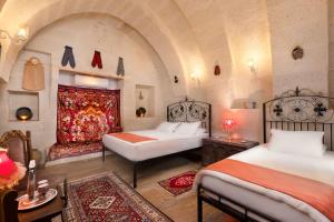 Postel nebo postele na pokoji v ubytování HacıAşık Konağı Butik Hotel