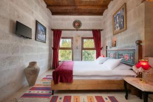 Postel nebo postele na pokoji v ubytování HacıAşık Konağı Butik Hotel