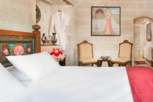 Postel nebo postele na pokoji v ubytování HacıAşık Konağı Butik Hotel