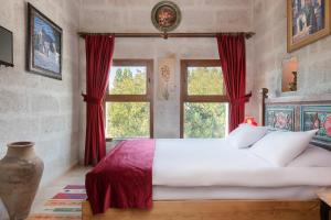 Postel nebo postele na pokoji v ubytování HacıAşık Konağı Butik Hotel