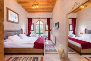 Postel nebo postele na pokoji v ubytování HacıAşık Konağı Butik Hotel
