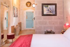 Postel nebo postele na pokoji v ubytování HacıAşık Konağı Butik Hotel