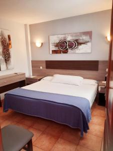 Ένα ή περισσότερα κρεβάτια σε δωμάτιο στο Hostal La Colonia