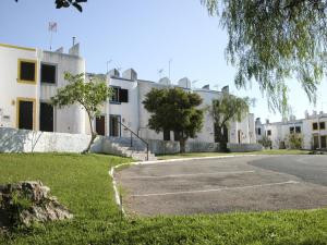 an empty parking lot in front of a building at Almargem Villa 77 Cozy 1BR in Cabanas de Tavira, Near the Beach in Cabanas de Tavira