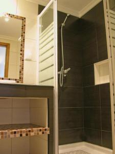 a shower with a glass door in a bathroom at Almargem Villa 77 Cozy 1BR in Cabanas de Tavira, Near the Beach in Cabanas de Tavira