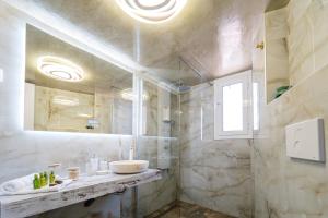 a bathroom with a sink and a mirror at Aura Celestia in Kavála +58 photos