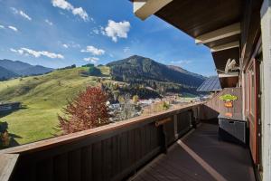 a balcony with a view of a mountain at Appartement Kogelblick in Saalbach Hinterglemm