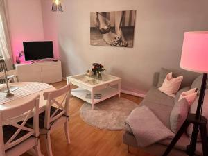 a living room with a table and a dining room at Wohnung in Wuppertal Elberfeld in Wuppertal