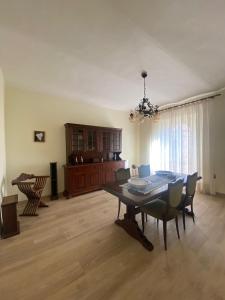 a living room with a dining room table and chairs at La casa di Peppe e Lucia in Poggio Bustone