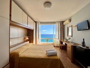 מיטה או מיטות בחדר ב-Hotel La Stella