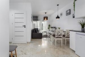 Posedenie v ubytovaní Kapitański Mostek Apartments Kołobrzeg by Noclegi Renters