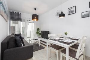 Posedenie v ubytovaní Kapitański Mostek Apartments Kołobrzeg by Noclegi Renters