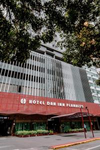 a hotel dmg inn china is shown in front of a building at Hotel Dan Inn Planalto São Paulo in São Paulo