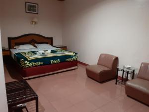Postel nebo postele na pokoji v ubytování Hotel Parewisata