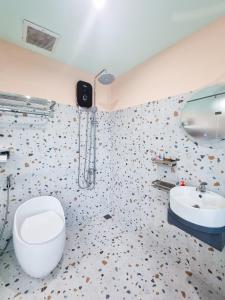 a bathroom with a toilet and a sink at Q apaz Serviced Apartment - 45TL in Ho Chi Minh City