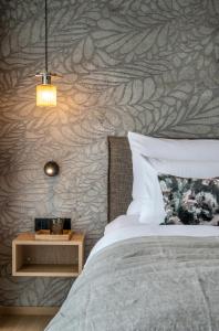 Łóżko lub łóżka w pokoju w obiekcie NEUWIRT - Boutiquehotel & Wirtshaus