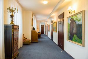 a hallway of a home with a painting on the wall at Skipper Hotel in Kaliningrad