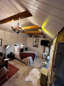 a bedroom with a bed in a room at Charming stone Bothy at Loch Lomond in Luss