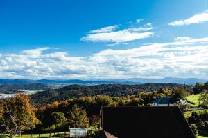 a view of the mountains from a house at Sunny Oak Estate in Mengeš