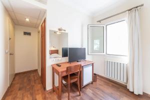 a room with a desk with a computer on it at Seckin Konaklar in Bodrum City