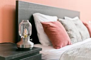 A bed or beds in a room at Dob Duplex Apartment