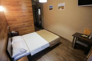 Hotel Kochevnik na Zherdeva tesisinde bir odada yatak veya yataklar