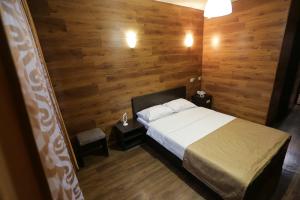 Un ou plusieurs lits dans un hébergement de l'établissement Hotel Kochevnik na Zherdeva